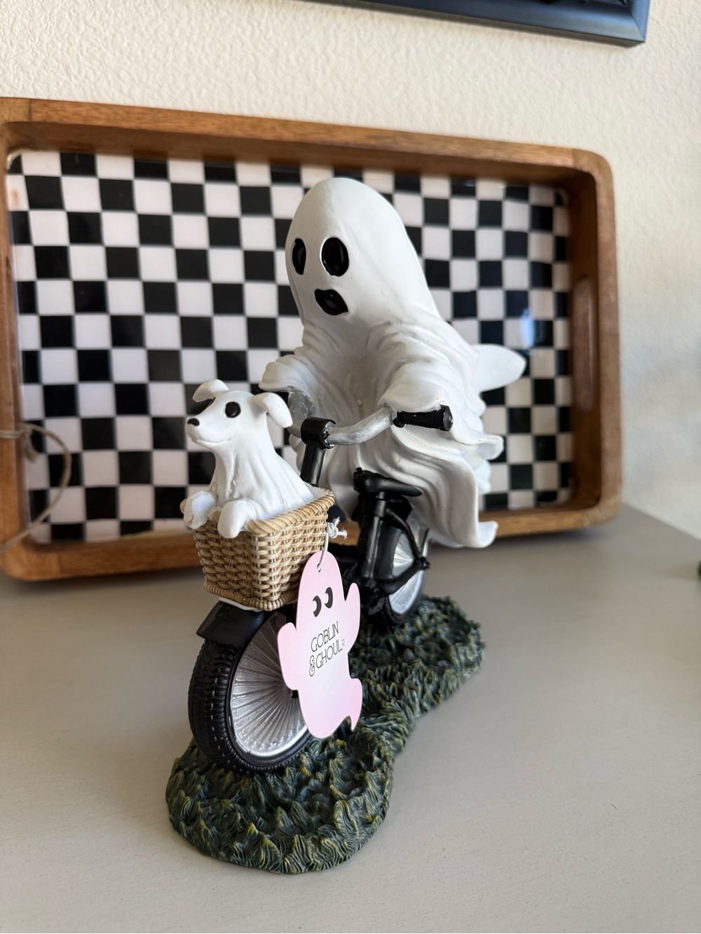 White Ghost Figurine Riding Bicycle with Dog in Basket
